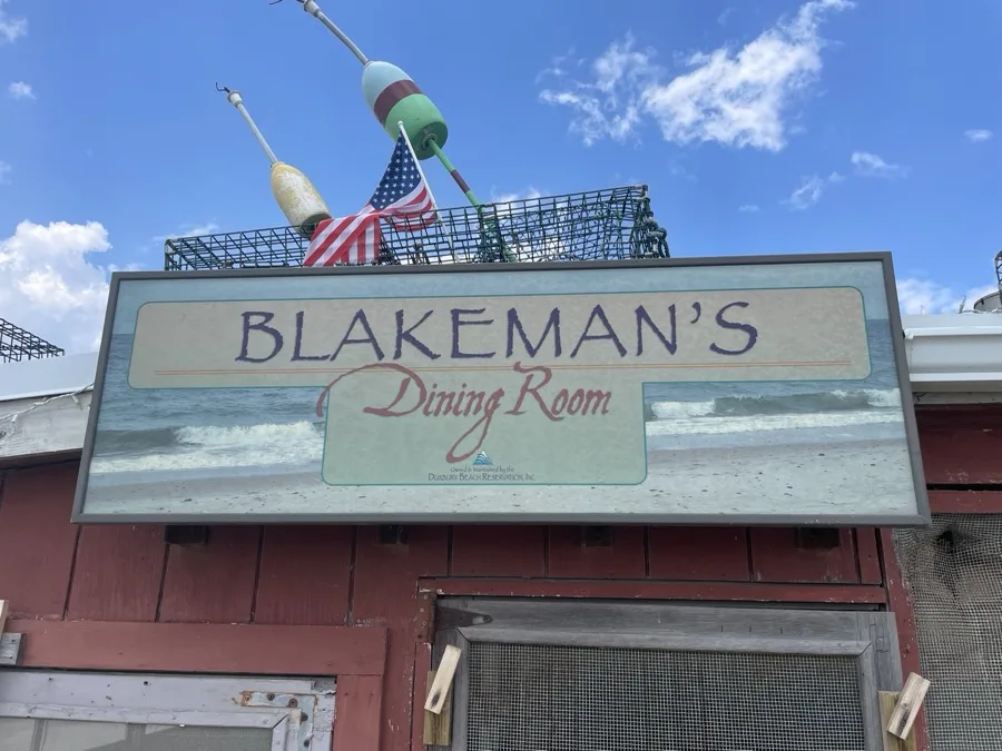 Blakeman's Dining Room sign with lobster traps and buoys